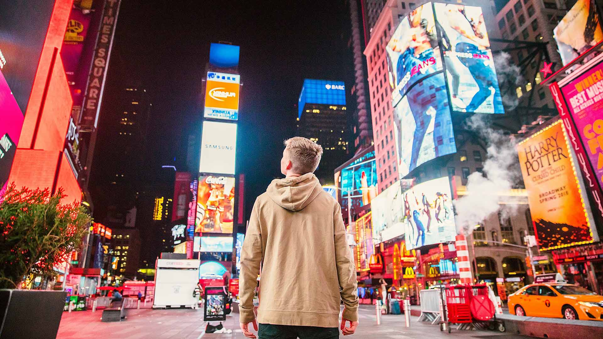 Man standing in Times Square
