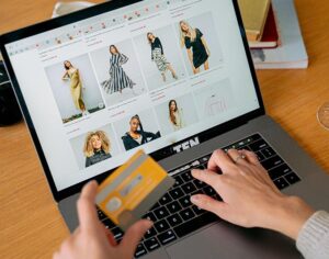 Person at computer order clothes online.
